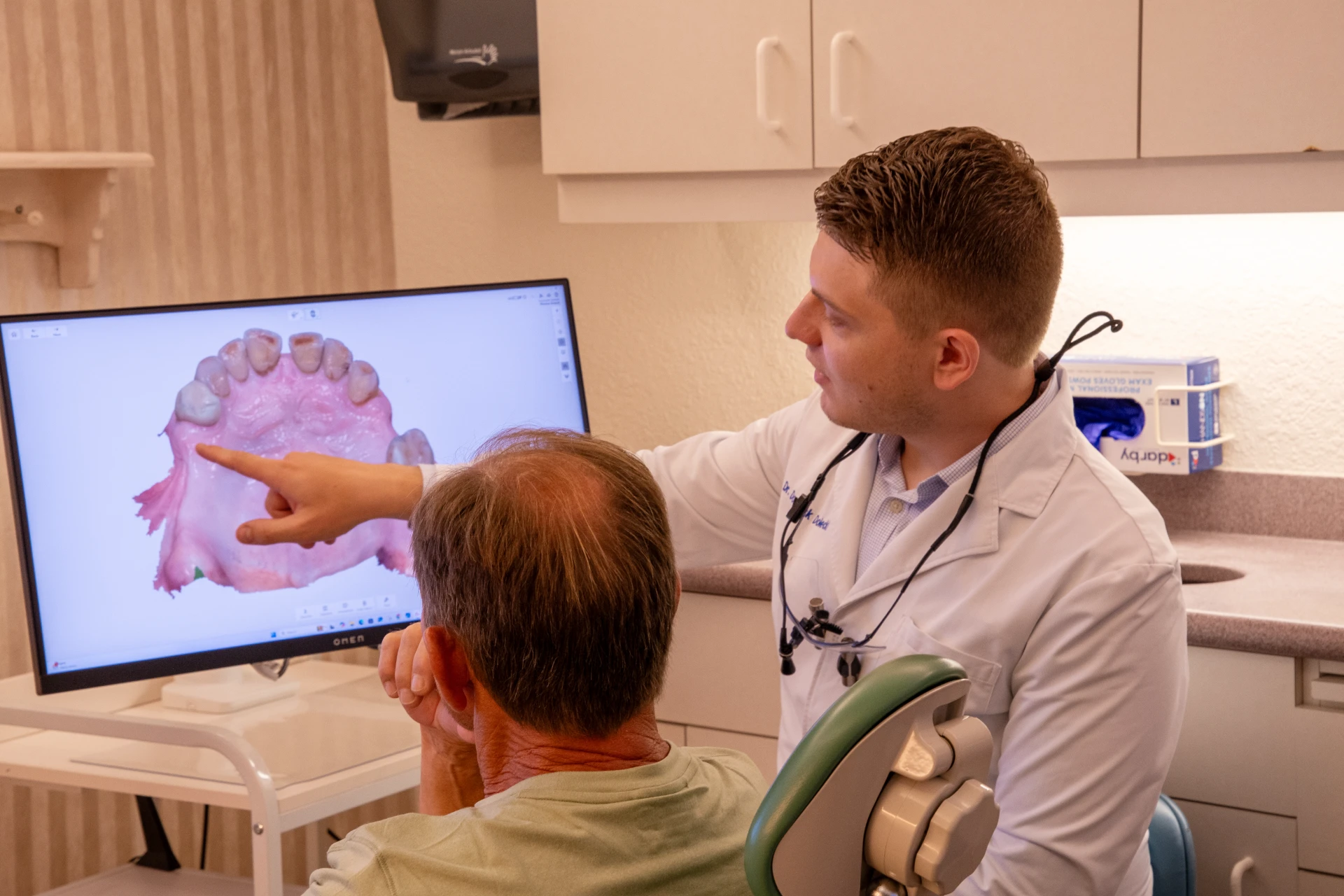 Dr. Dolecki walking a patient through a 3D digital scan | Dentist in Punta Gorda, FL